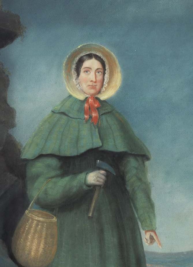 Portrait of Mary Anning in her green cloak and straw bonnet, with a basket over her arm and a hammer in her hand.