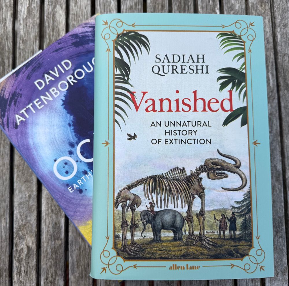 Two books in their dust jackets, the lower one called Ocean and the upper one Vanished An unnatural history of extinction with an elephant and mastodon skeleton on the cover. 