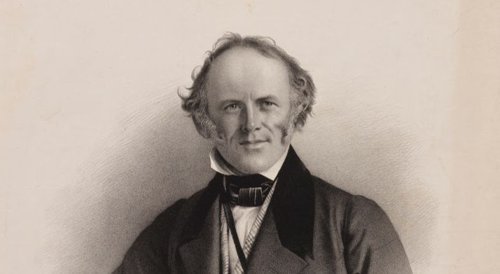 A portrait of Charles Lyell, in a. dark coat, a high shirt collar, his hair receding, with long sideburns, and looking quite pleased with himself. 
