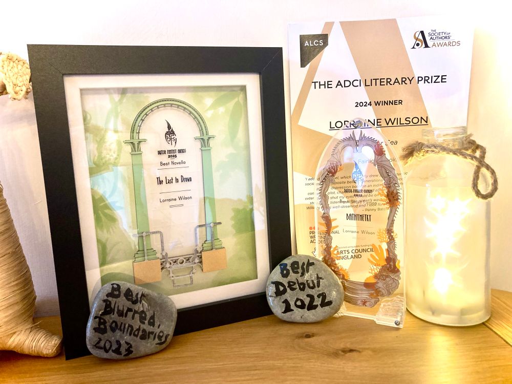 A photo of my wee award collection - two BFAs, the SoA ADCI prize certificate and two SCKAward rocks