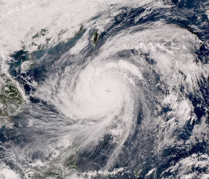 Satellite image of Typhoon Fung-wong (Philippines: Typhoon Uwan) taken at around 2 pm today, November 9. Photo courtesy of JMA Himawari (Japan Meteorological Weather Center). It's baaically one giant white spiral completely obscuring the Philippines and the surrounding ocean, with faint hints of the Vietnamese coast on the left.