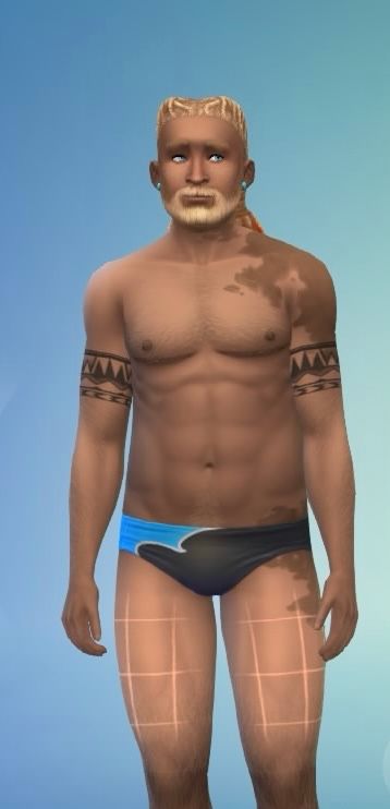 The same man faces front wards, wearing a blue and black speedo.  We see circular tribal tattoos on both upper arms, and top surgery scars.  He also has a darker birth mark on his left thigh, up his waist and slightly stomach area.  There is another one on his left shoulder, covering almost the entire area, down to the tattoo. 