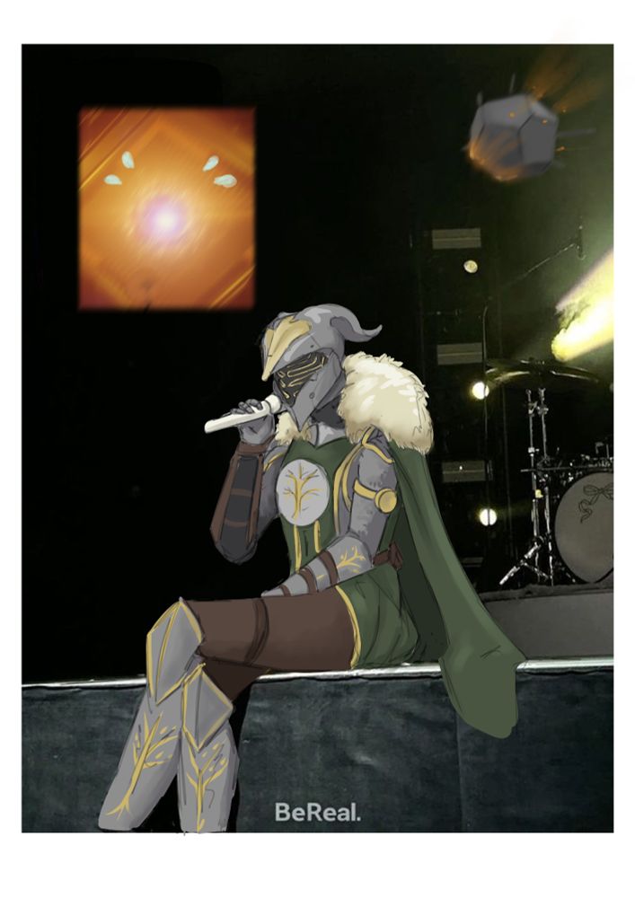Felwinter sitting on a stage holding a mic with Rasputin in the background