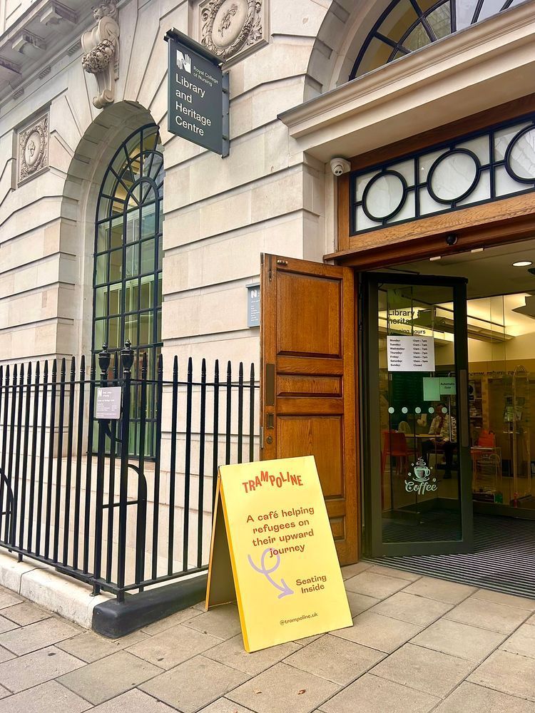 Exterior view of the RCN Library and Museum, featuring a board promoting the Trampoline café