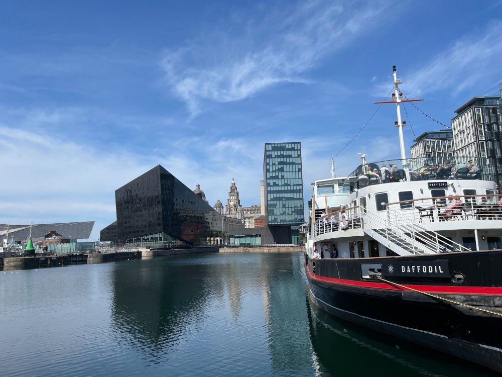 Boat with modern buildings in the background