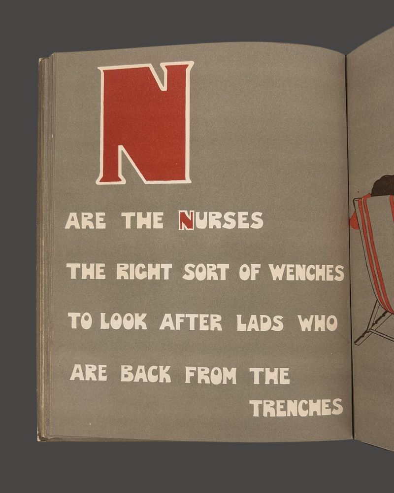 A vintage book page with the letter "N" in red and text that reads, "are the nurses, the right sort of wenches, to look after lads who are back from the trenches"