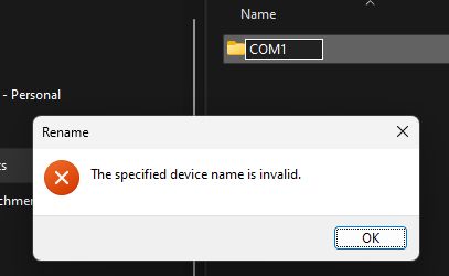 An attempt at renaming a folder COM1 with an error stating, "The specified device name is invalid."