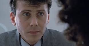 A close up of Carter Burke, a character from the movie Aliens.  He looks nervous.