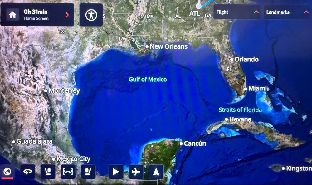 Photo of a Delta airlines seat back monitor showing a map that refers to the body of water off the southern United States as the Gulf of Mexico. 