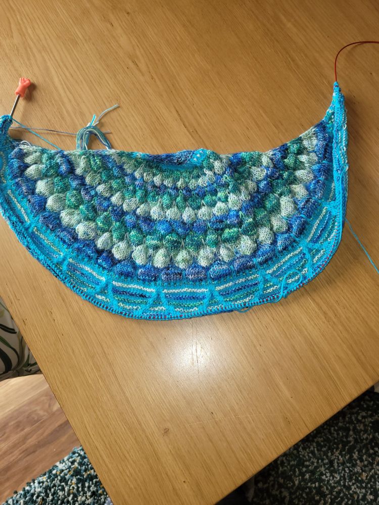 Bubbly Blossoms Shawl knitted in Rosie's Moments - Ferns, Hobbii Unicorn - Turquoise, Mrs S Creations - Seaglass and Siobhans Crafts - Ravenclaw 