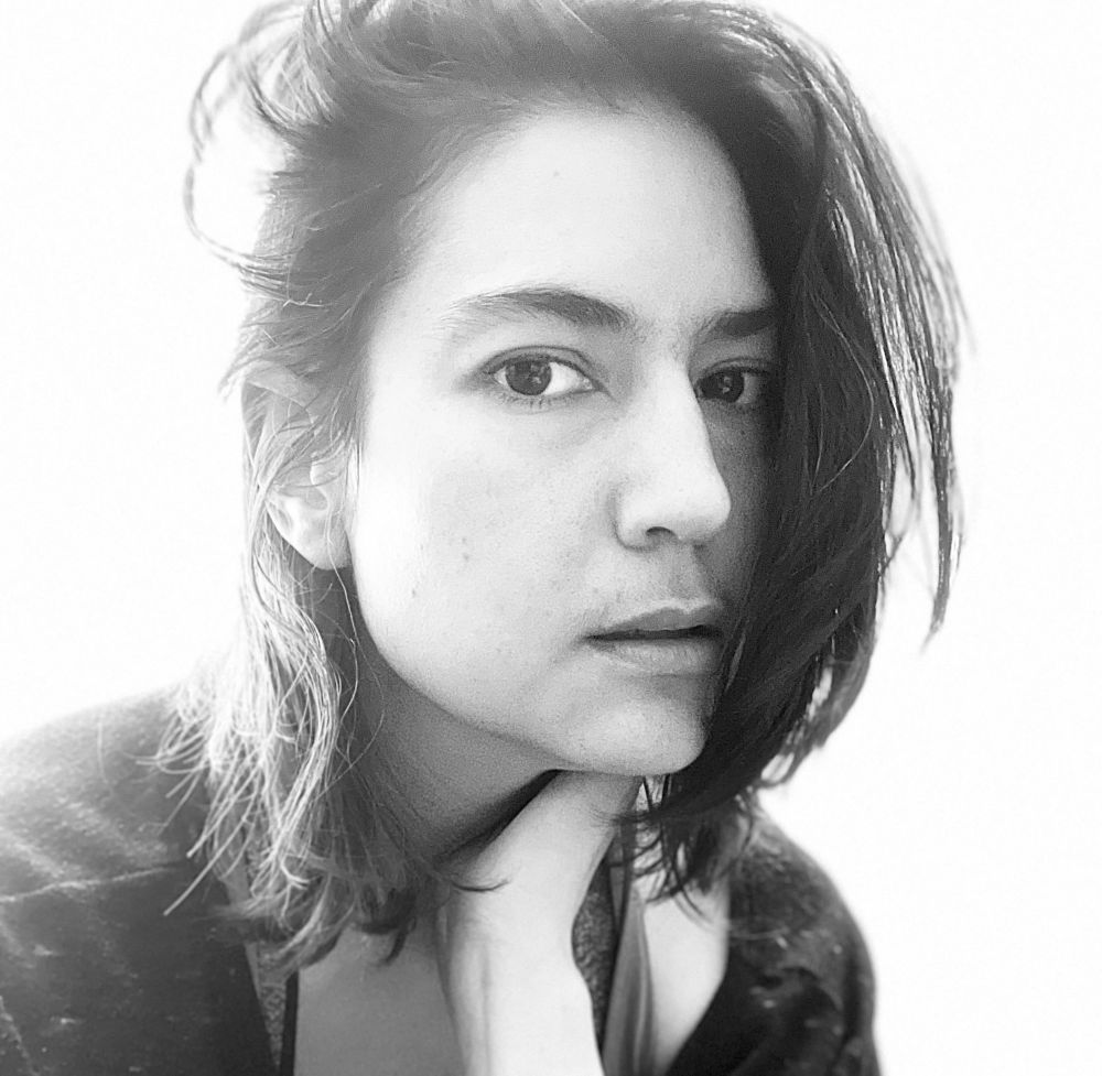 Black & white photo of a thoughtful-looking author.