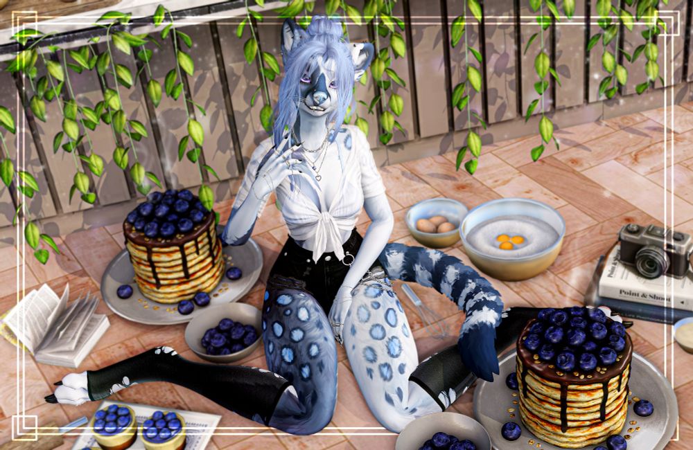 A female cat-looking lady sits on the floor of her kitchen, surrounded by various sweets that contain blueberries. She has a sweet look on her face, almost confused.