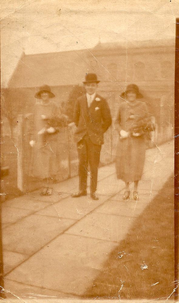 25th November 1925, bridesmaids Grace Moden and Gladys Anderson, with unidentified 'best man', at St. Mary's Church, Ely.