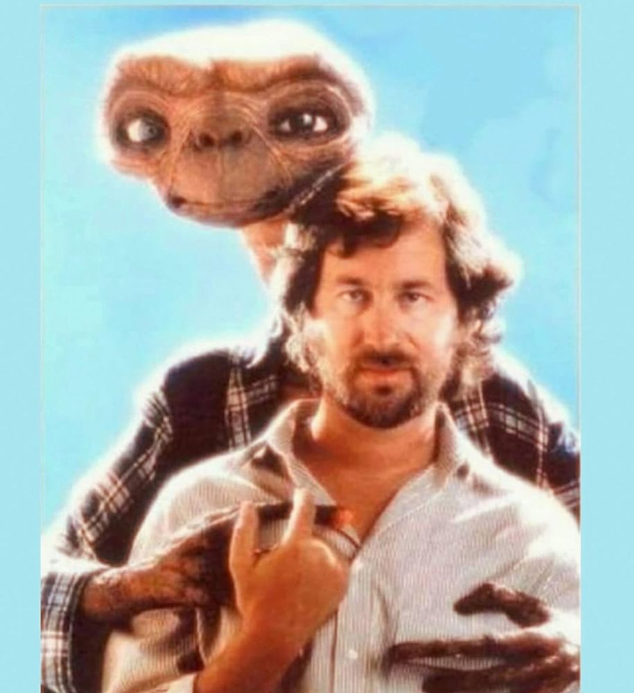 E.T. With his arms draped lovingly around Steven Spielberg from behind.