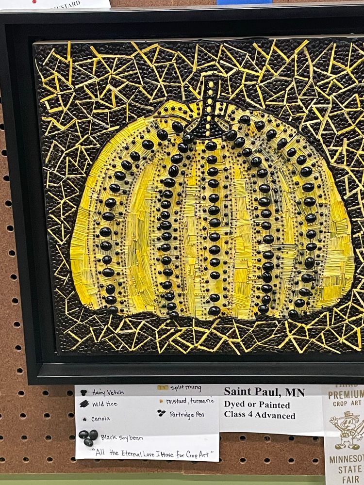 Yellow and black crop art of a big pumpkin looking thing that sure looks like Yayoi Kusama’s pumpkins
