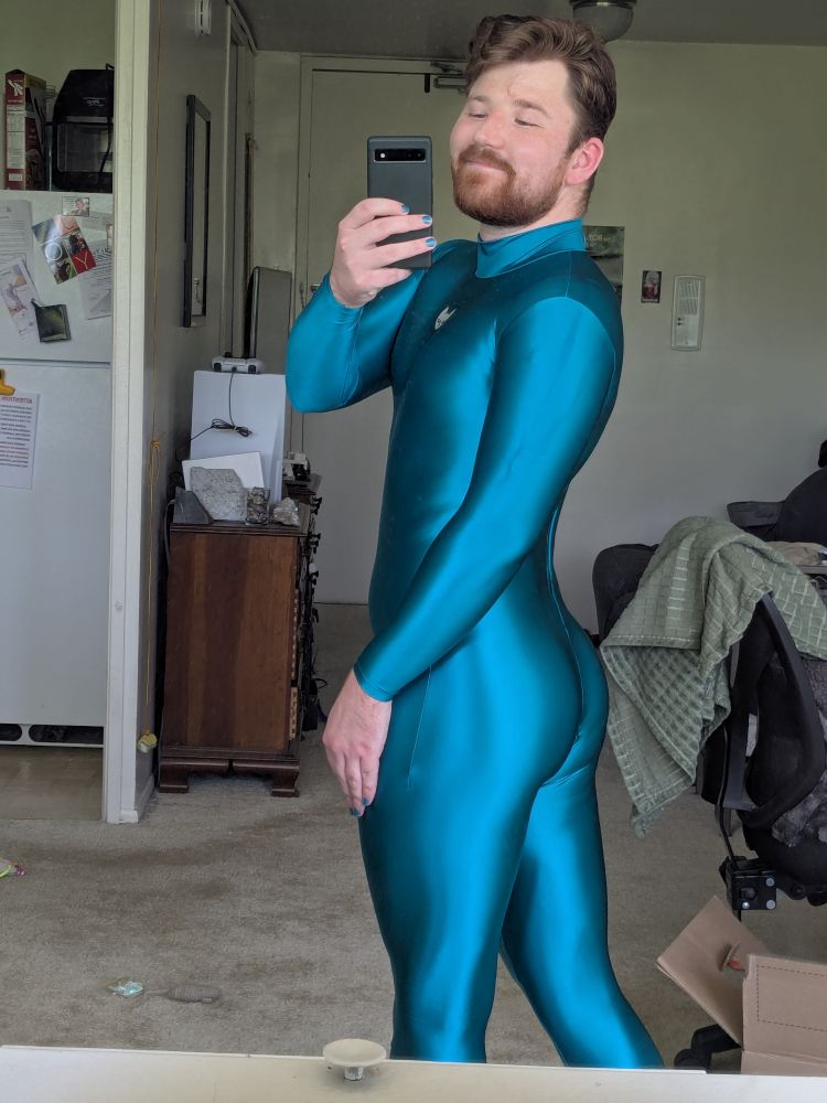 Myself staring into the pic, emphasizing my ass in team spandex suit.