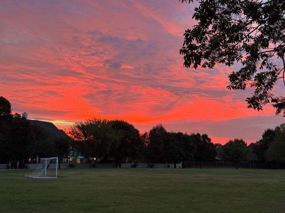 sunrise over a soccer field
