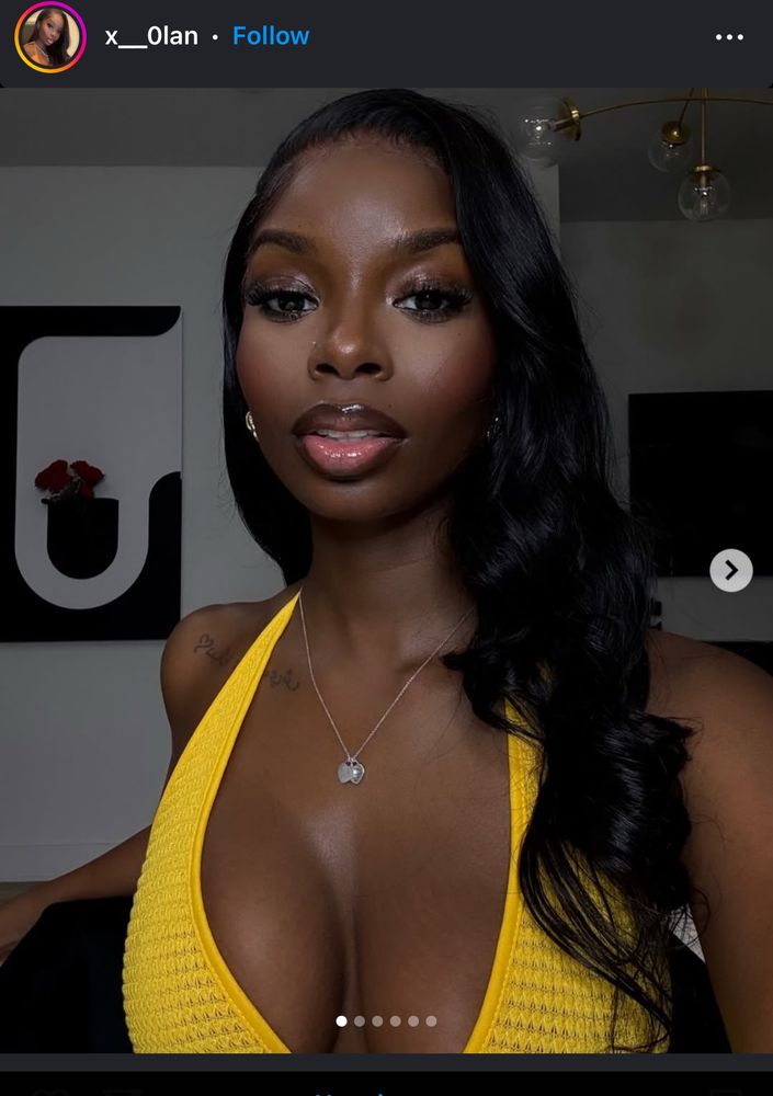 A picture of a woman with a yellow top