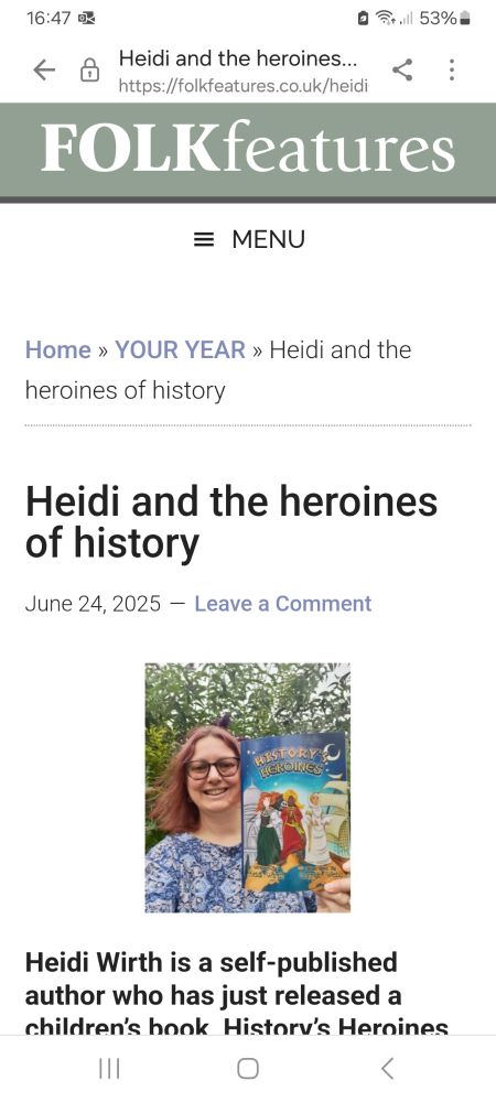 Image is a screenshot of Folk Features home page, featuring me, with the title: Heidi & the Heroines of history. A photo of me holding my book, History's Heroines, and then the subtitle: Heidi Wirth is a self-published author who has just released a children's book History's Heroines. 