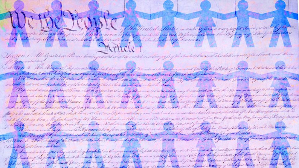 Phot of the top of the US constitution with "We the People" in upper left hand corner with  a foggy pink and blue overlay. 3  translucent rows of paper people (male and female) reach from end to end guarding the constitution.