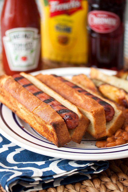 Two hot dogs on PROPER TOP-SLICED ROLLS with baked beans