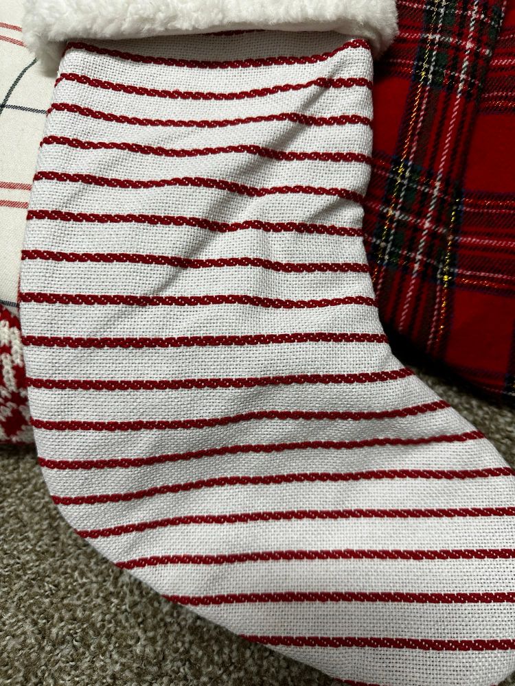 A red and white striped Christmas stocking. 
