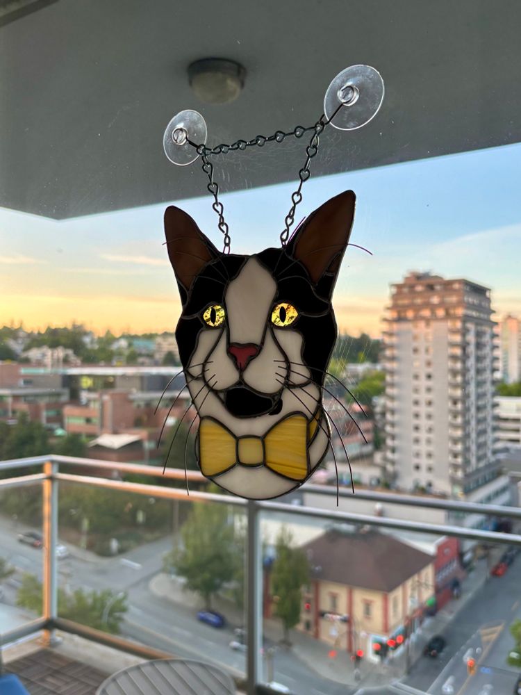 Stained glass art of my cat, Ghoulie, wearing a yellow bow tie
