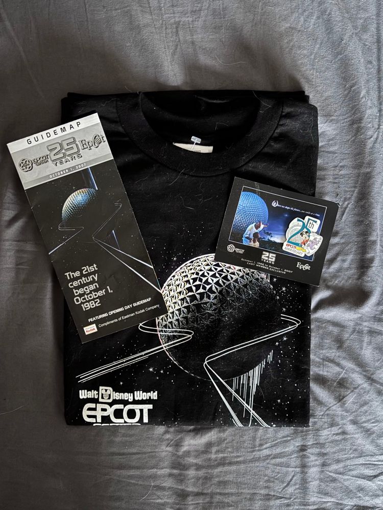 Shirt, pin, and guidemap from EPCOT’s 25th anniversary