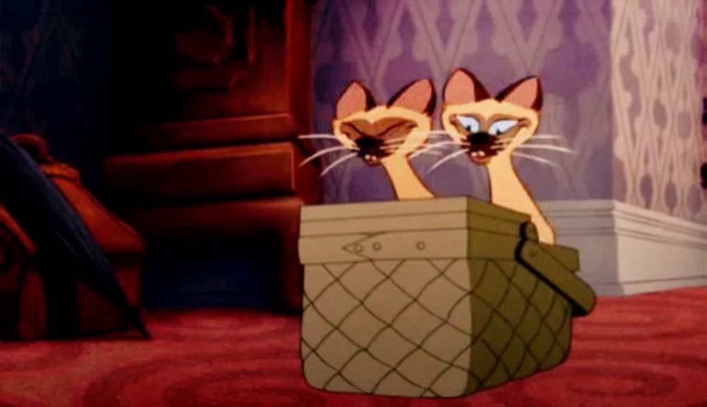 two cartoon cats are sitting in a box with their heads sticking out