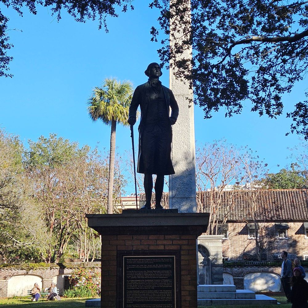 A statue of George Washington keeps watching over Washington Park near the Four Corners of Law in Charleston.
