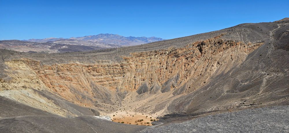Ubehebe crater happened when some magma found some water... kaboom. This is reminiscent of the Sedan crater on the Nevada National Security Site, but it is a bit less radioactive. 
