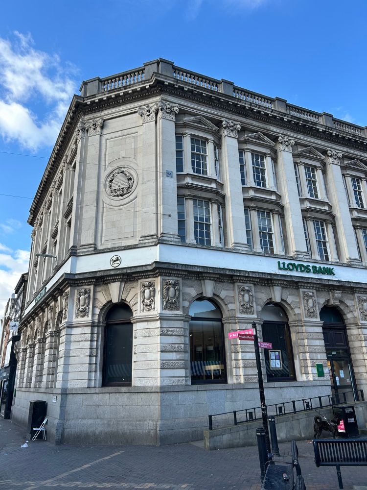 Lloyds Bank, handsome corner building in classical style. 