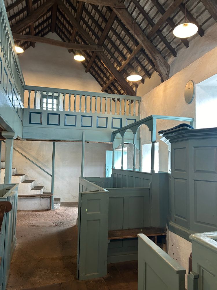 Pulpit, a box pew and gallery.