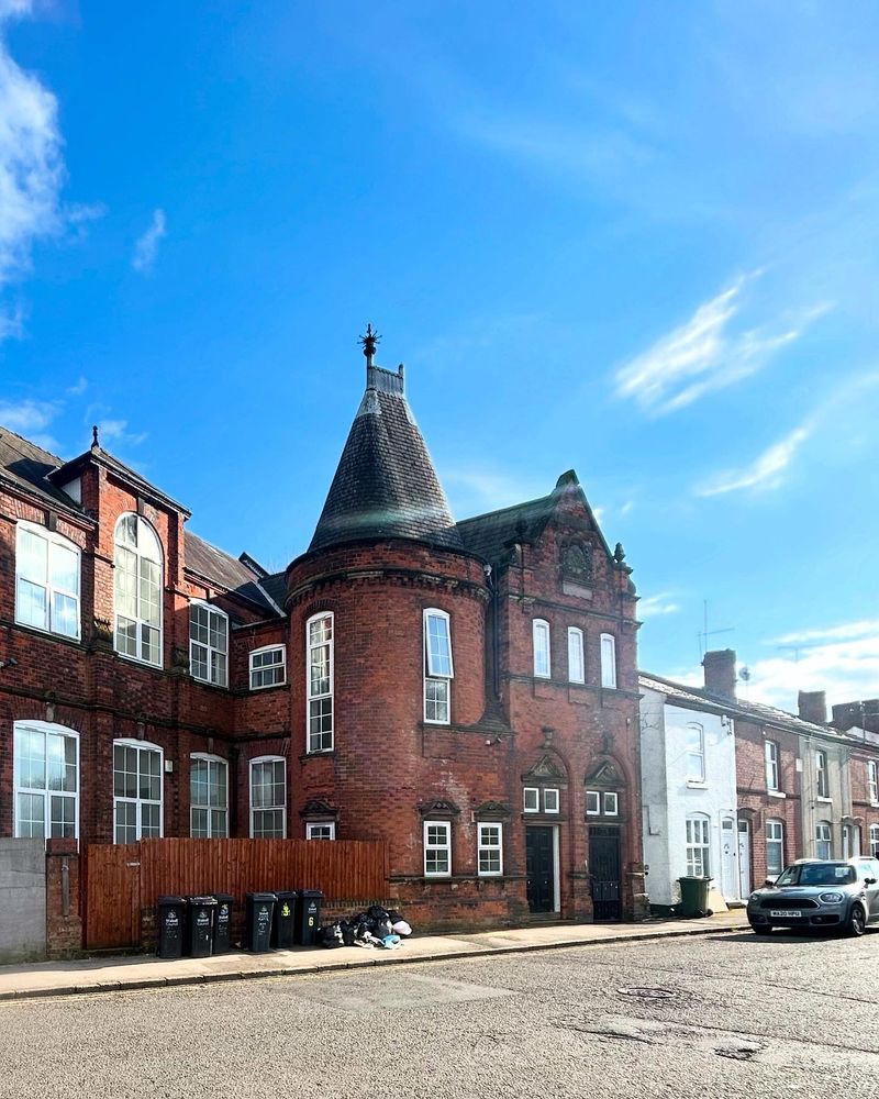 Former education building, Red clay brick, chateau-ish