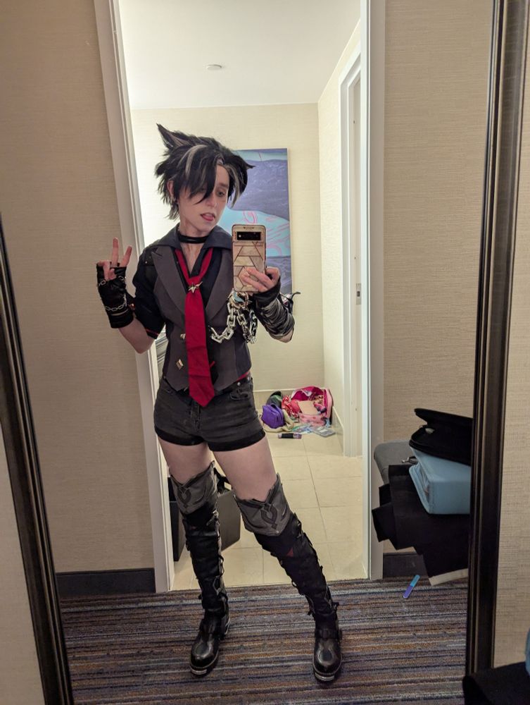 mirror selfie of a cosplayer wearing  wriothesley from henshin impact, the pants have been switched out for small shorts. 