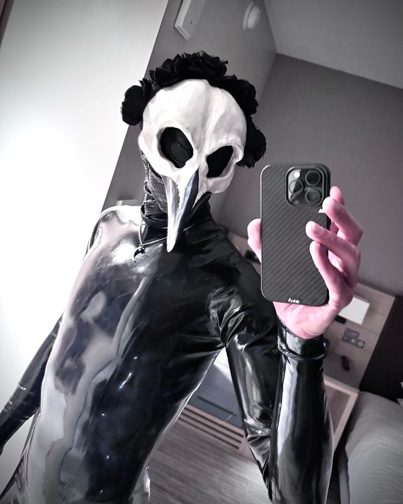 A rubber bird taking a selfie.