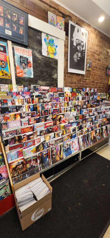 New small press and general interest single issues displayed on salesfloor of Comics N’More, a comics book store.