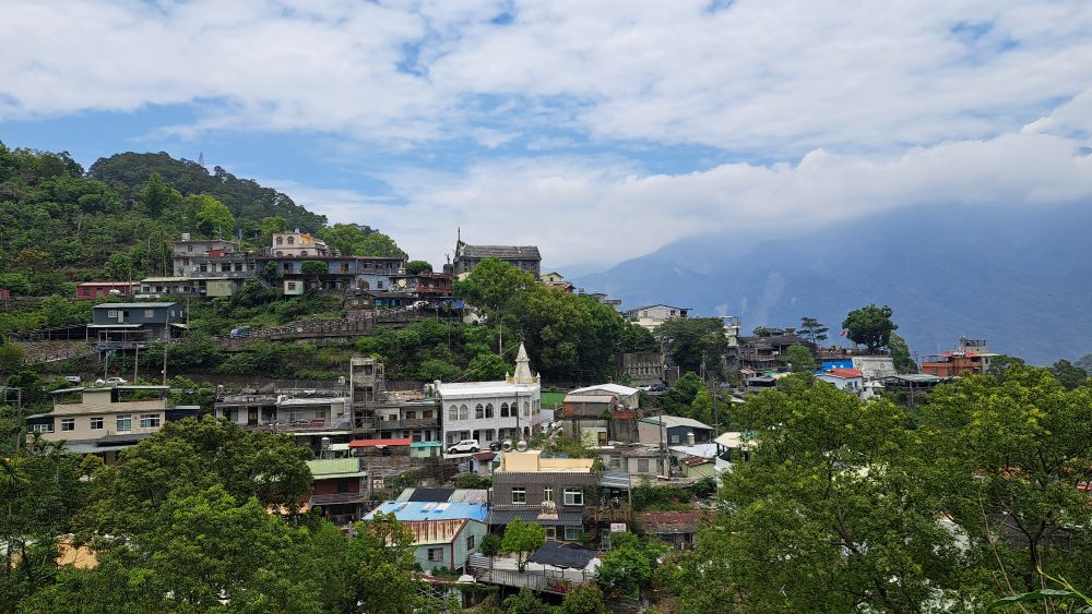 view of Wutai Vedai 霧台 village with blue sky, mountains, and clouds 