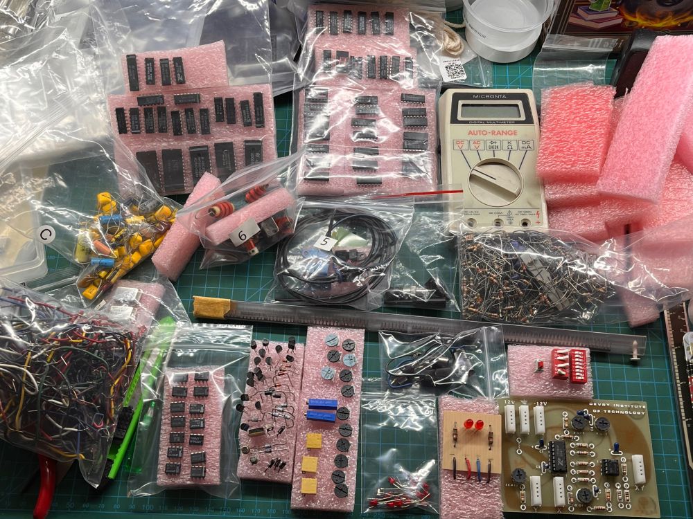 From random piles of resistors, capacitors, jumper wires, chips and other electronics prototyping components, I sorted the contents of two tackle boxes into this pile of things that have nice homes in my current sorting system.  Now, when I need something specific, I can look in one place instead of many.  I'll find some new use for the tackle boxes. 