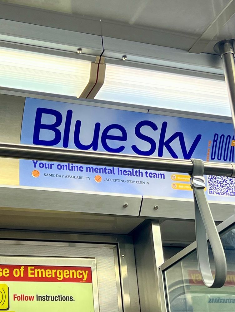 An ad on a CTA train for “Blue Sky, your online mental health team”