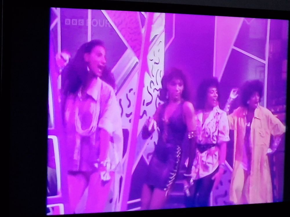 Sister Sledge performing 'Frankie' on Top Of The Pops, with 3 dressed like they are going to a family barbecue and the lead singer dressed like she's off to a swinger club.