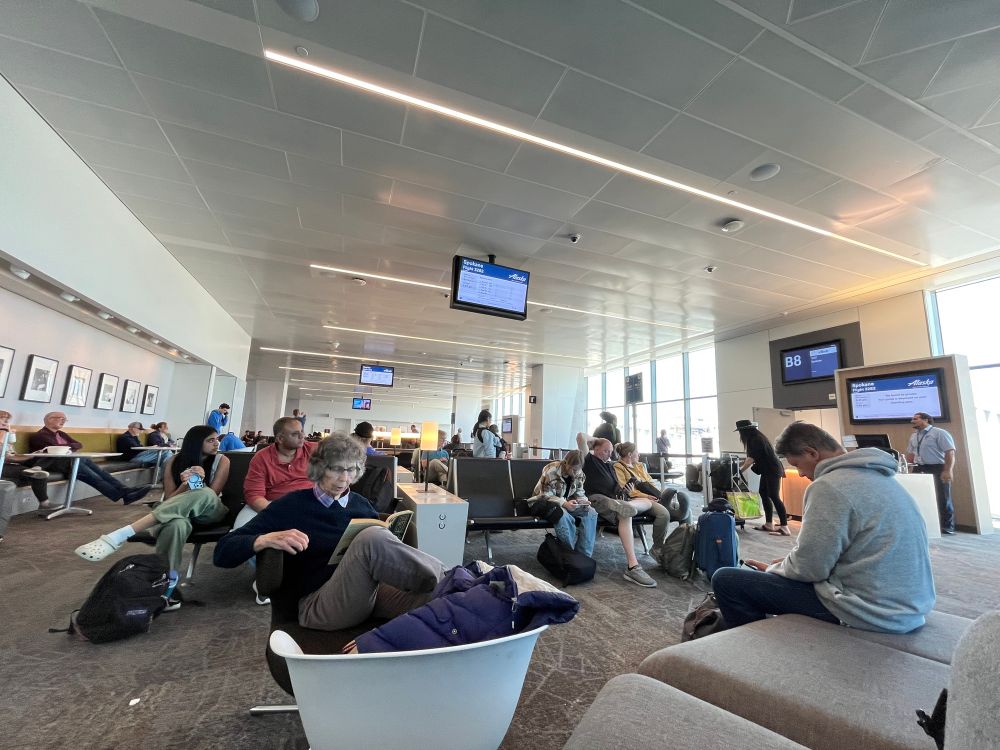 People waiting at boarding gates at San Francisco International Airport