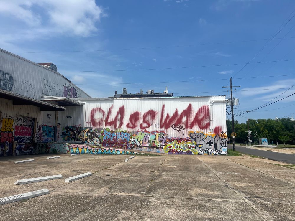 Large piece of graffiti that says “Class War” in large red letters