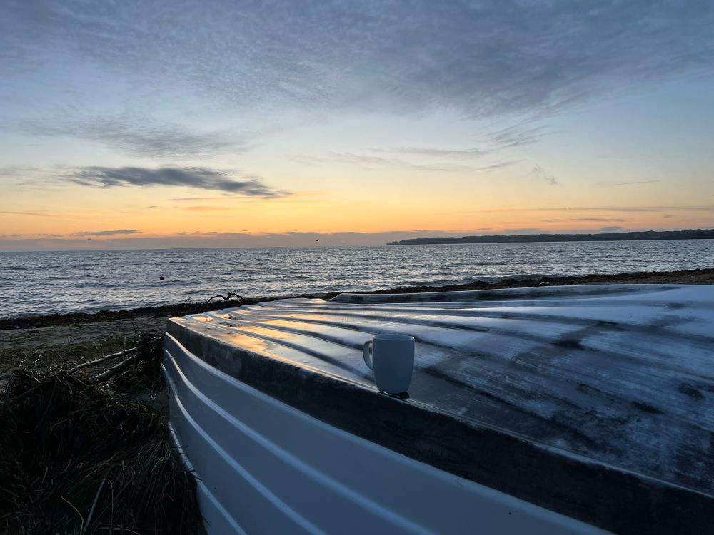 Sunrise at Danish beach with a coffee