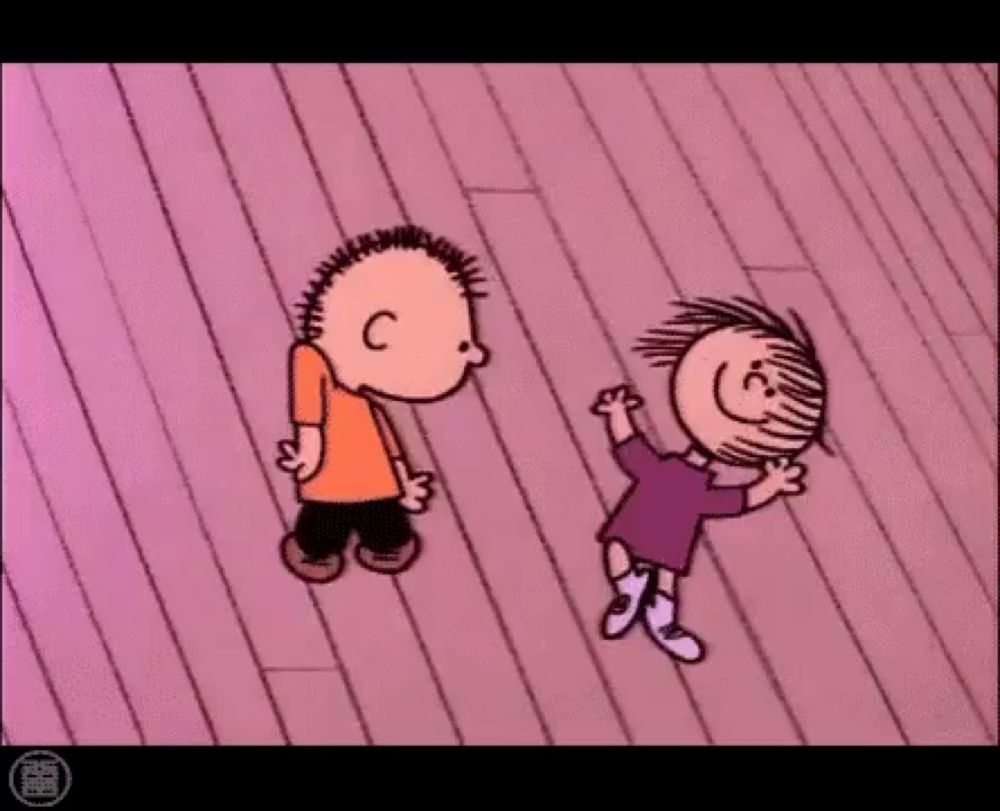 a boy and a girl are dancing on a pink wooden floor .