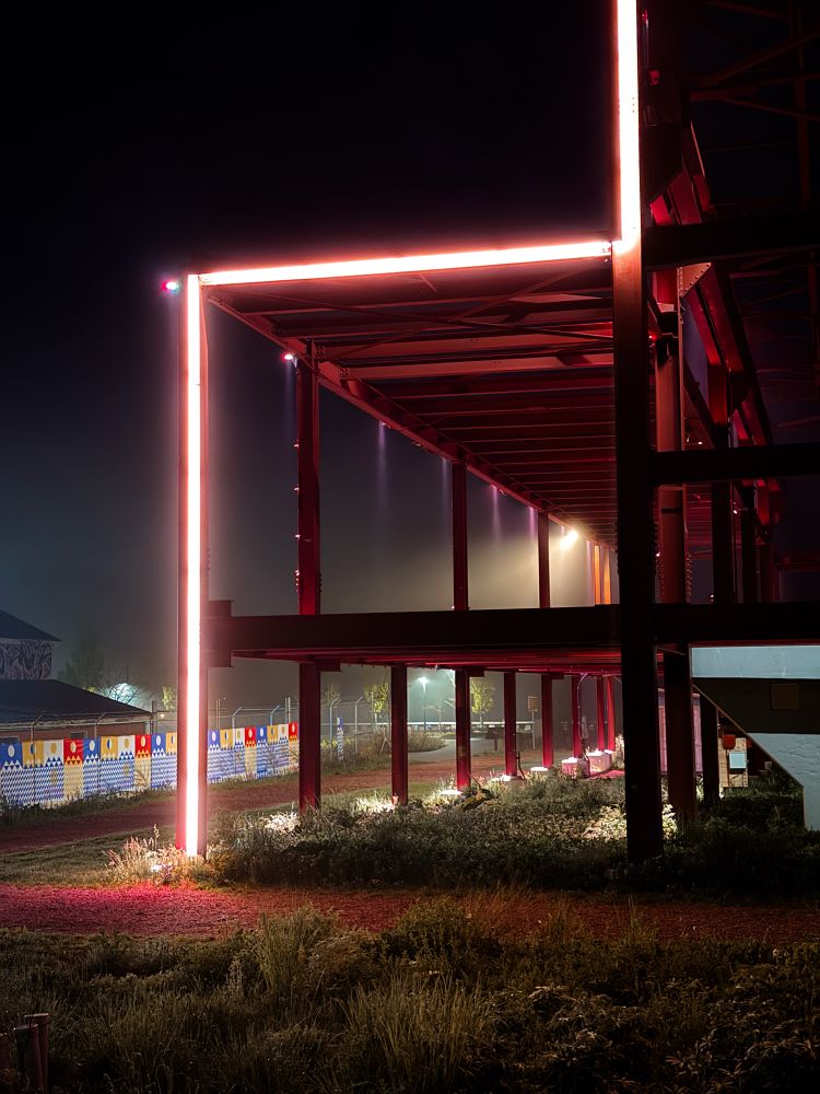 Frame of an old power plant at night 