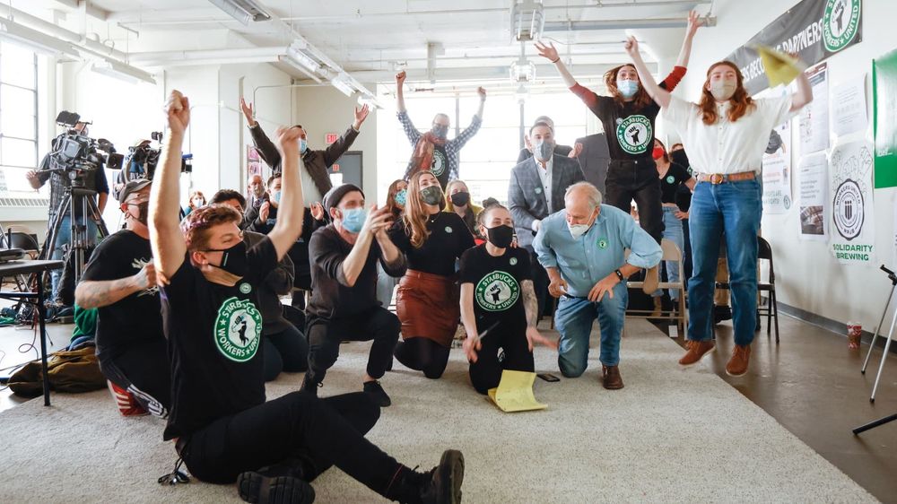 A group of SBWU members celebrating after winning the first Starbucks union in the US