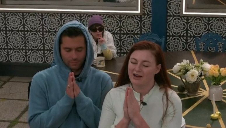 jimmy and rachel with their eyes closed and hands in the form of a prayer bb27. 