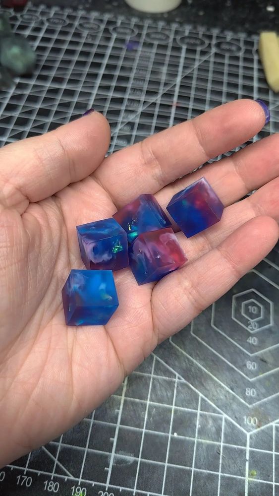 5 piece blank dice inserts that are cubed for D6s. These do not have their numbers on them yet, and are still raw dice.