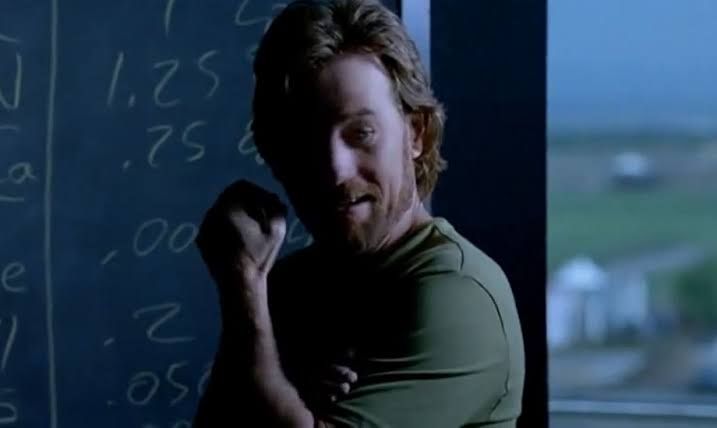 Bryan Cranston as Walter White in Breaking Bad, flashback scene where he's in front of a blackboard working out the components of the human body